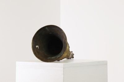 Lot 552 - An Ottoman brass tulip candlestick