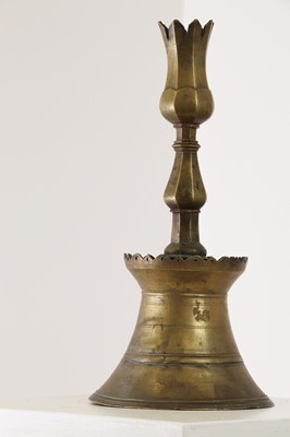 Lot 552 - An Ottoman brass tulip candlestick