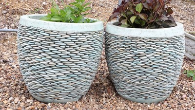 Lot 510 - A pair of pebble stone garden planters