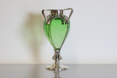 Lot 114 - An Arts and Crafts green glass and silver-mounted vase