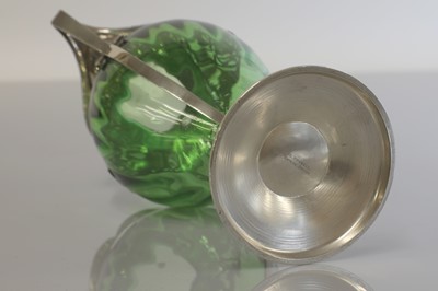 Lot 114 - An Arts and Crafts green glass and silver-mounted vase