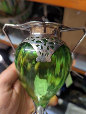 Lot 114 - An Arts and Crafts green glass and silver-mounted vase