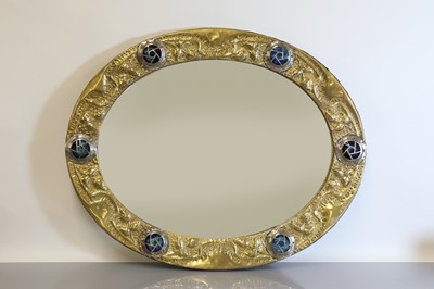 Lot 121 - An Arts and Crafts embossed brass mirror