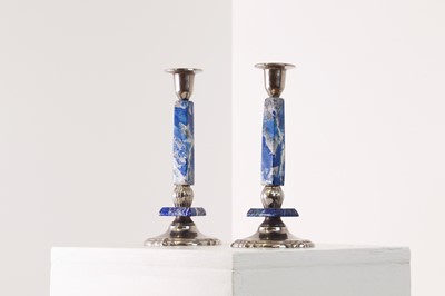 Lot 319 - A pair of silvered-metal and lapis lazuli candlesticks