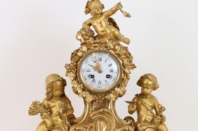 Lot 645 - A gilt-bronze mantel clock