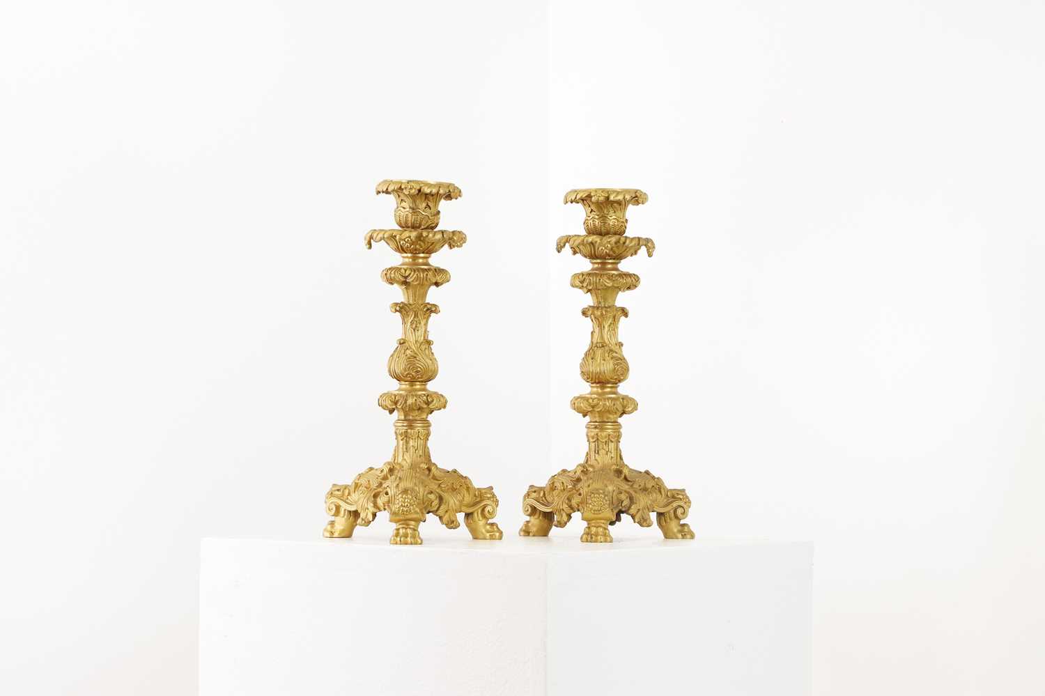 Lot 651 - A pair of gilt-bronze candlesticks
