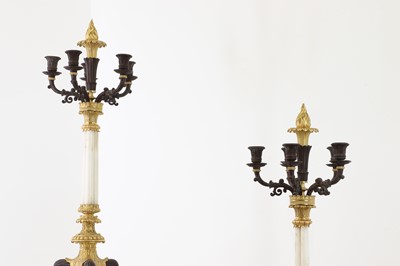 Lot 648 - A pair of Regency-style bronze and parcel-gilt candelabra
