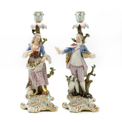 Lot 75 - A pair of porcelain Meissen style figural candelabrum