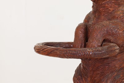 Lot 636 - A Black Forest carved wood stick stand
