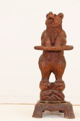 Lot 636 - A Black Forest carved wood stick stand