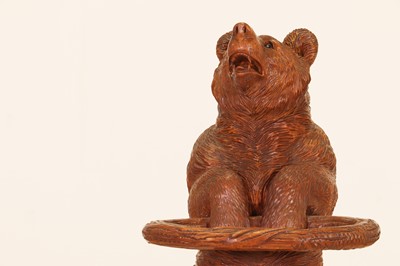 Lot 636 - A Black Forest carved wood stick stand