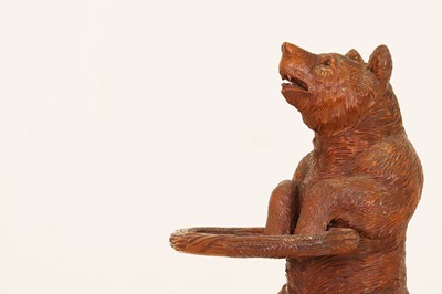 Lot 636 - A Black Forest carved wood stick stand