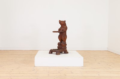 Lot 636 - A Black Forest carved wood stick stand