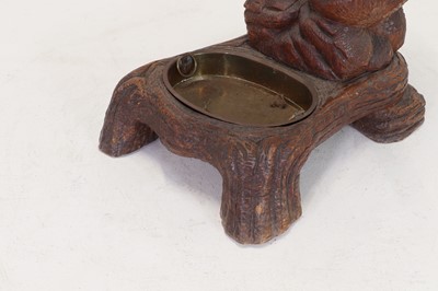 Lot 636 - A Black Forest carved wood stick stand