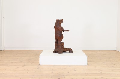 Lot 636 - A Black Forest carved wood stick stand