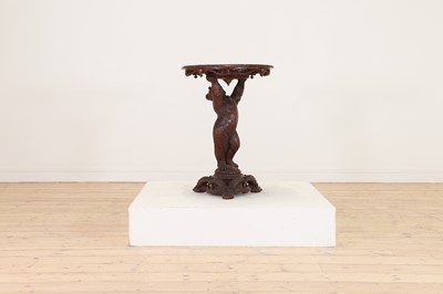 Lot 634 - A Black Forest carved wood occasional table