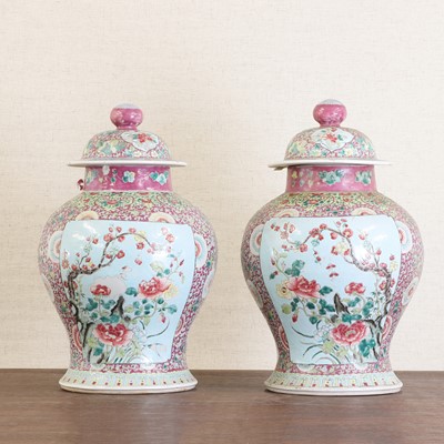 Lot 182 - A pair of Chinese famille rose vases and covers