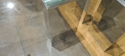 Lot 452 - A glass-topped coffee table