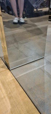 Lot 452 - A glass-topped coffee table