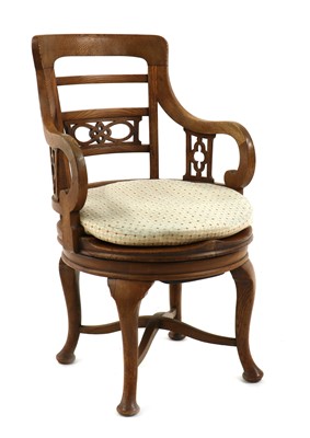 Lot 418 - An oak desk chair
