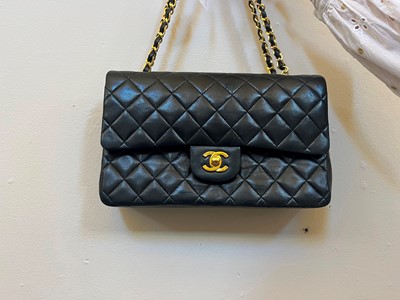 Lot 302 - A Chanel black leather medium flap bag