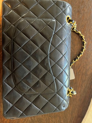 Lot 302 - A Chanel black leather medium flap bag