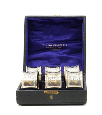 Lot 72 - A set of six cased silver napkin rings