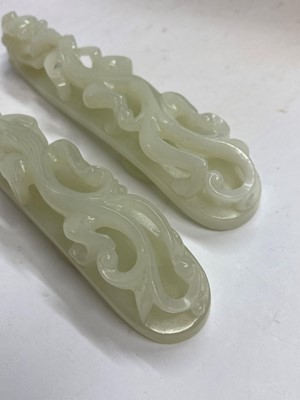 Lot 103 - Two Chinese jade belt hooks