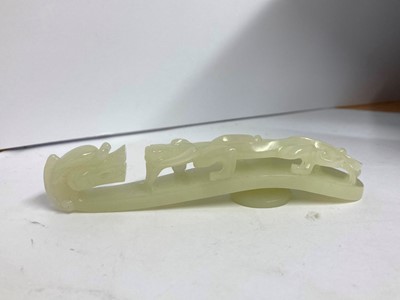 Lot 103 - Two Chinese jade belt hooks