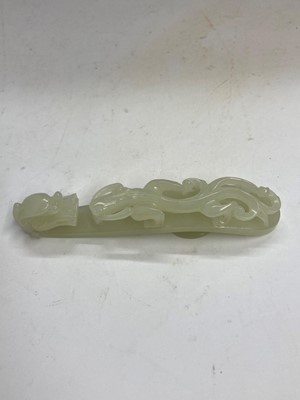 Lot 103 - Two Chinese jade belt hooks