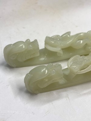 Lot 103 - Two Chinese jade belt hooks