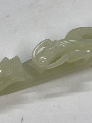 Lot 103 - Two Chinese jade belt hooks