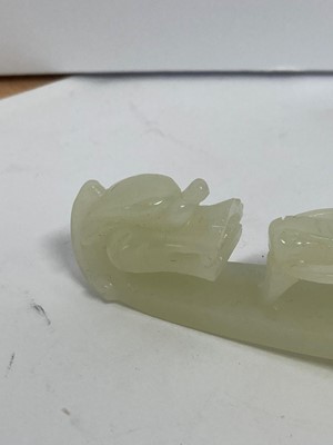 Lot 103 - Two Chinese jade belt hooks