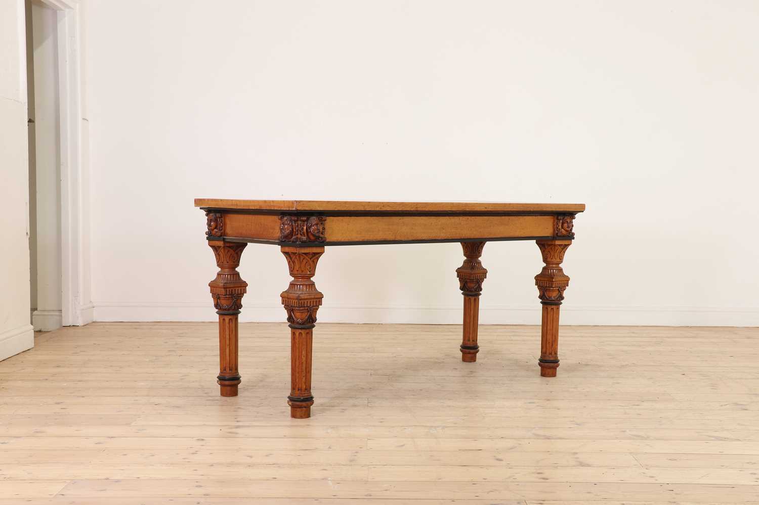 Lot 513 - A golden oak library table