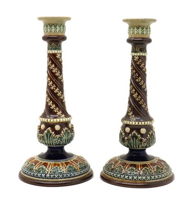 Lot 106 - A pair of Doulton Lambeth stoneware candlesticks