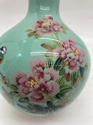 Lot 93 - A Chinese green glazed vase