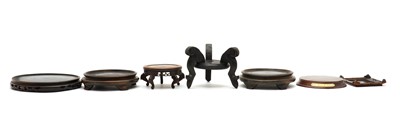 Lot 68 - A collection of Chinese wood stands