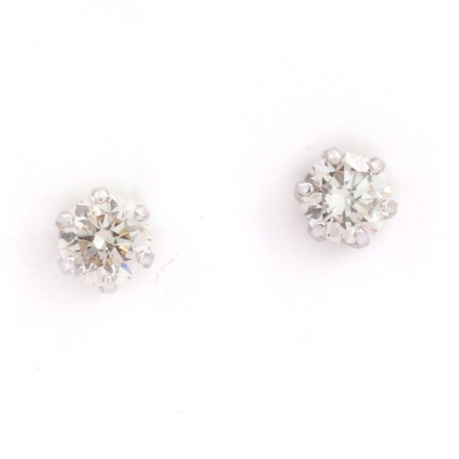 Lot 53 A pair of platinum diamond stud earrings,