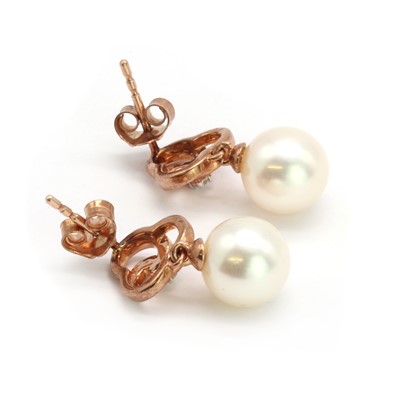 Lot 168 - A pair of 9ct rose gold diamond and cultured pearl drop earrings
