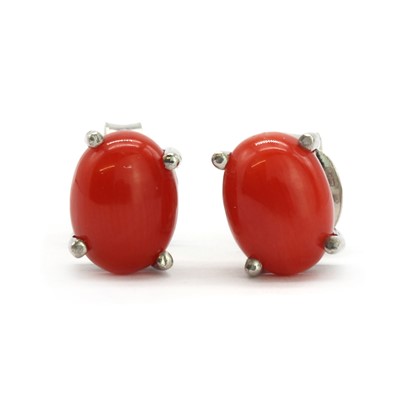 Lot 69 - A pair of silver and cabochon coral stud earrings