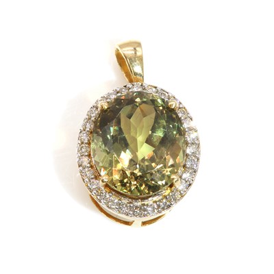 Lot 407 - An 18ct gold zultanite and diamond oval halo pendant