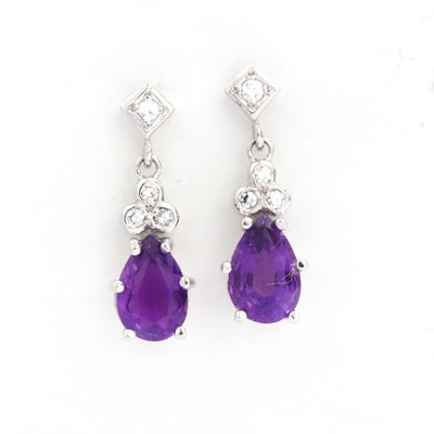 Lot 135 - A pair of 18ct white gold amethyst and diamond drop earrings