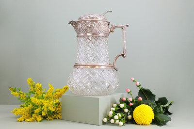 Lot 126 - A silver-mounted cut-glass lemonade or water jug