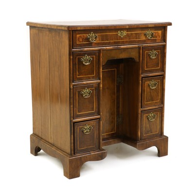 Lot 434 - A George I style strung walnut kneehole desk