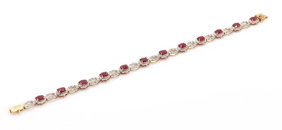 Lot 316 - An 18ct gold ruby and diamond line bracelet