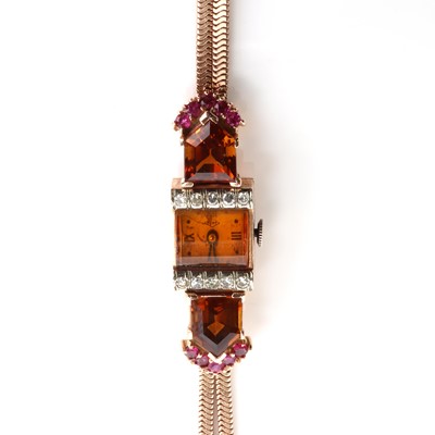 Lot 168 - An American rose gold citrine, diamond and ruby, mechanical cocktail watch, c.1940