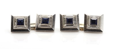 Lot 471 - A set of four French Art Deco platinum, sapphire and diamond buttons