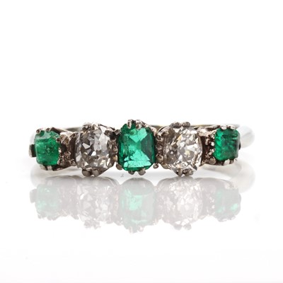 Lot 137 - A graduated five stone emerald and diamond ring