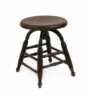 Lot 328 - An oak and iron machinist's stool