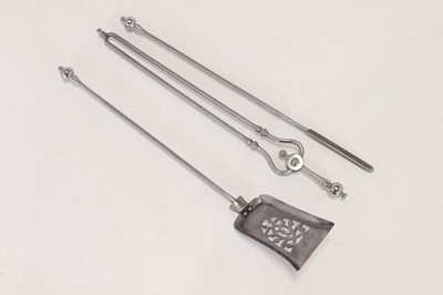 Lot 384 - A set of polished steel fire tools